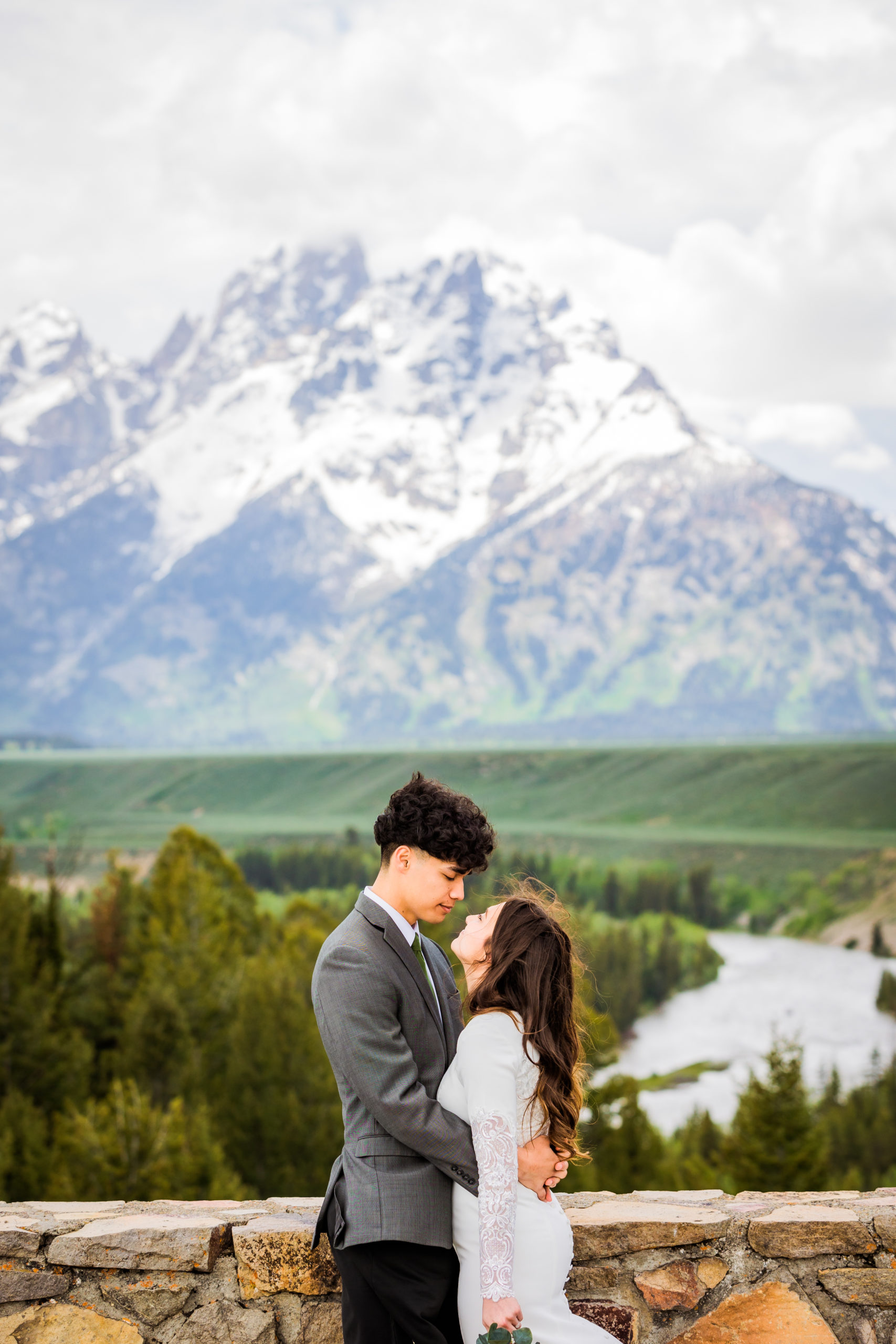 bride and groom embrace eahc other at Snake River Overlook