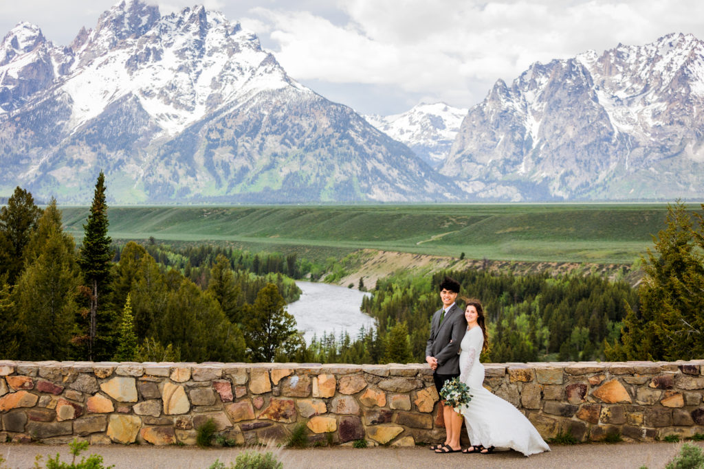 outdoor wedding phot ideas with bride and groom standing at Snake River Outlook together 