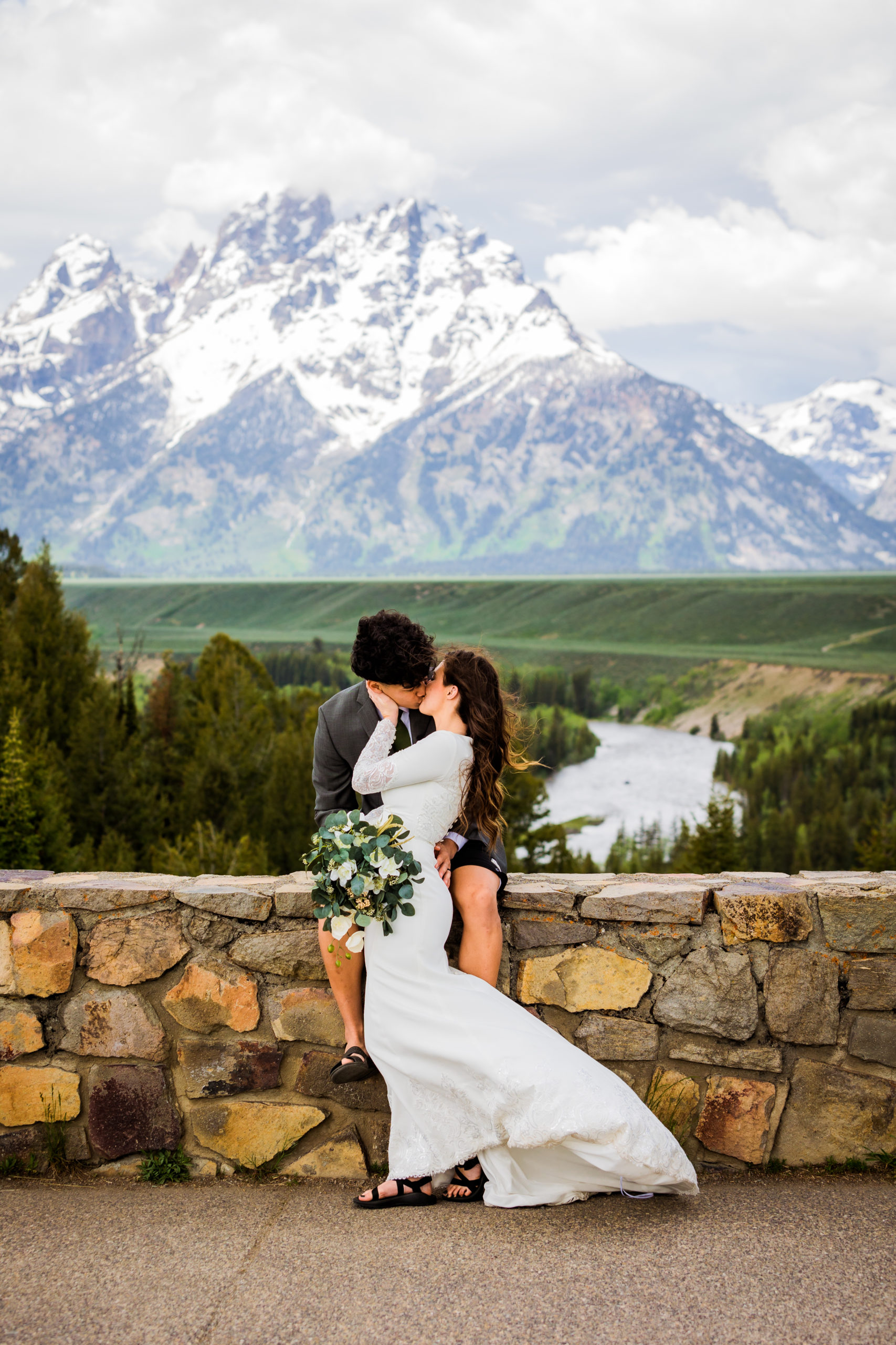 romantic elopement in the mountains with bride and groom kissing in front of the Grand Tetons