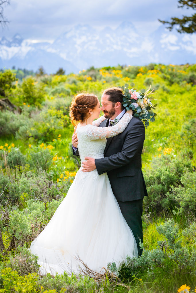 bride and groom embracing after getting married in Grand Teton without permit
