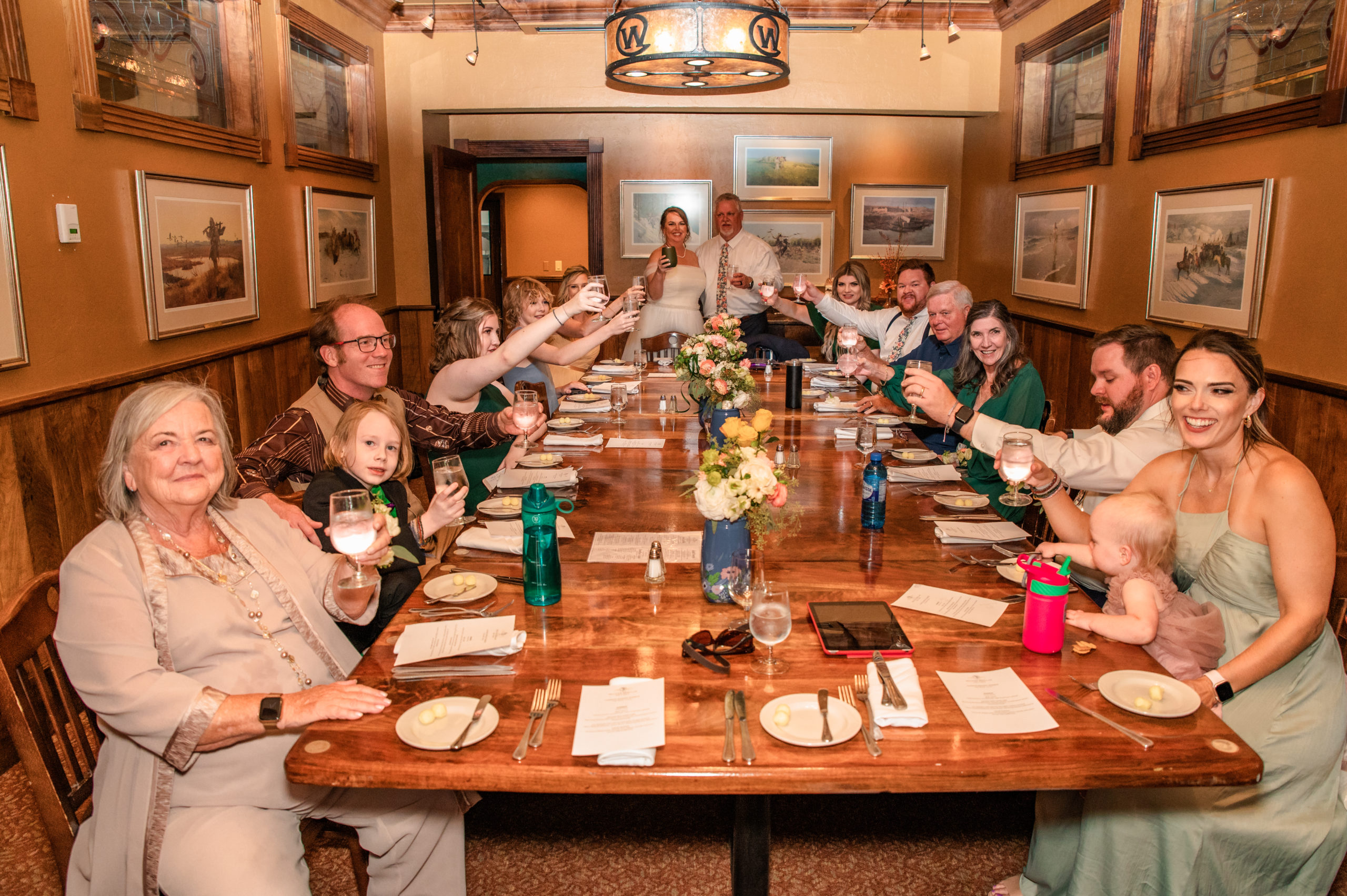 family celebrating recent jackson hole wedding at private room in the wort