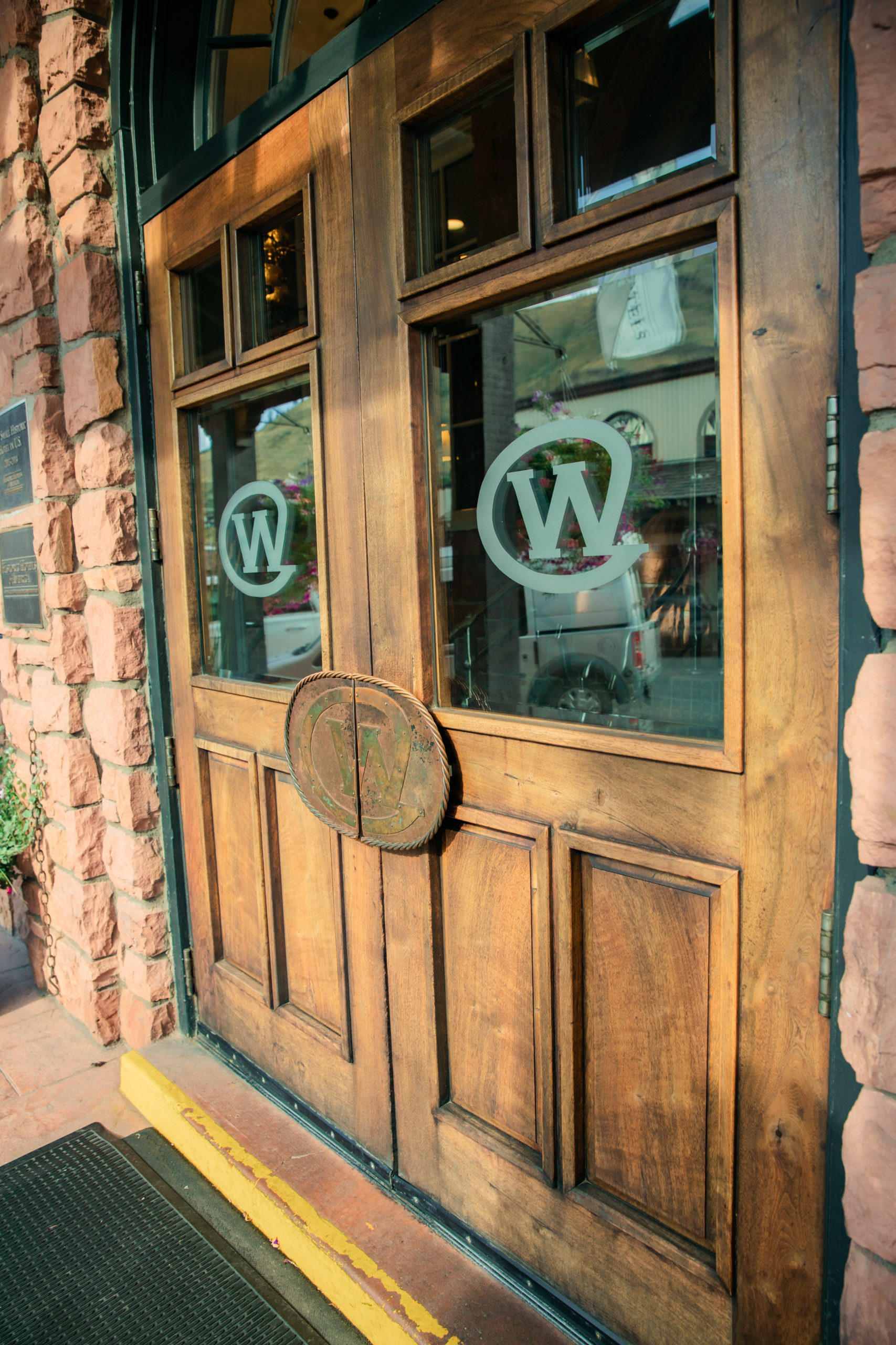 Doors with The Wort logo frosted into the windows. Doors have giant semi-circle handles.