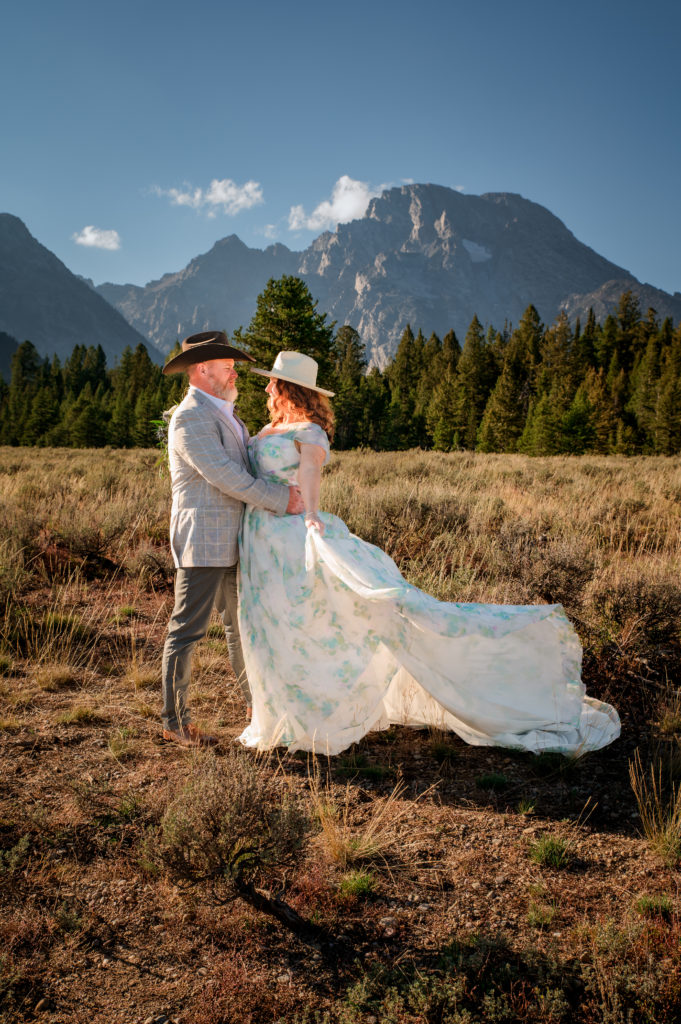 jackson hole wedding photographer captures bride and groom embracing after grand teton national park wedding