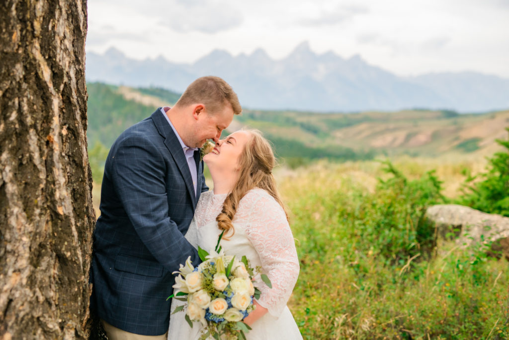 Jackson Hole wedding photographers captures bride and groom touching noses