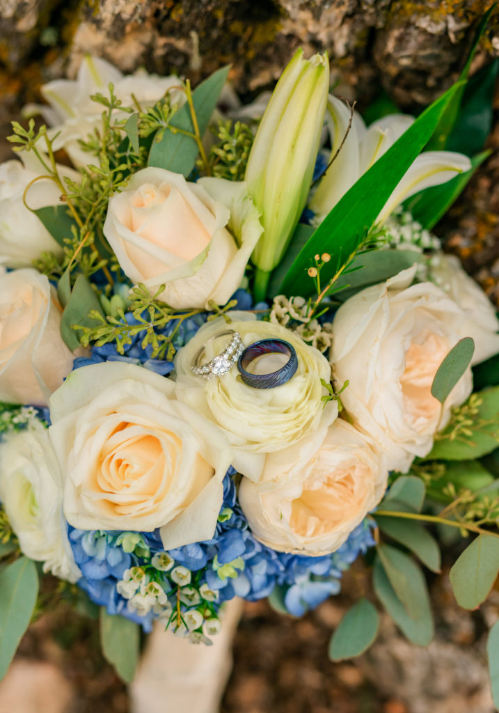 Jackson Hole wedding photographer captures ring shot in bridal bouquet