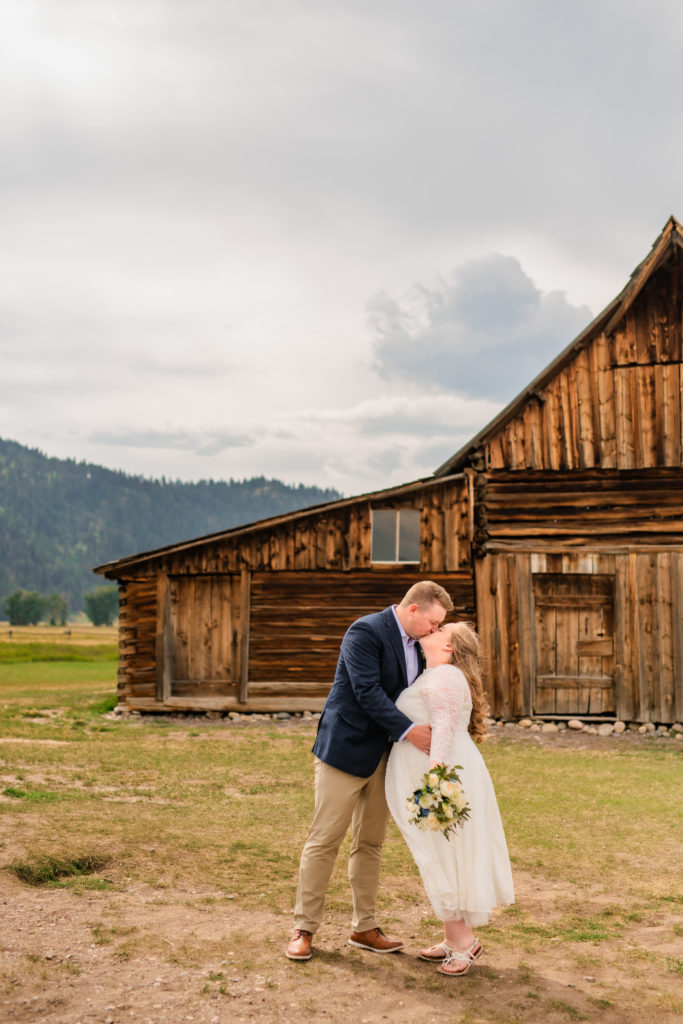 Jackson Hole wedding photographer captures newly married couple kissing in Grand Teton National Park wedding