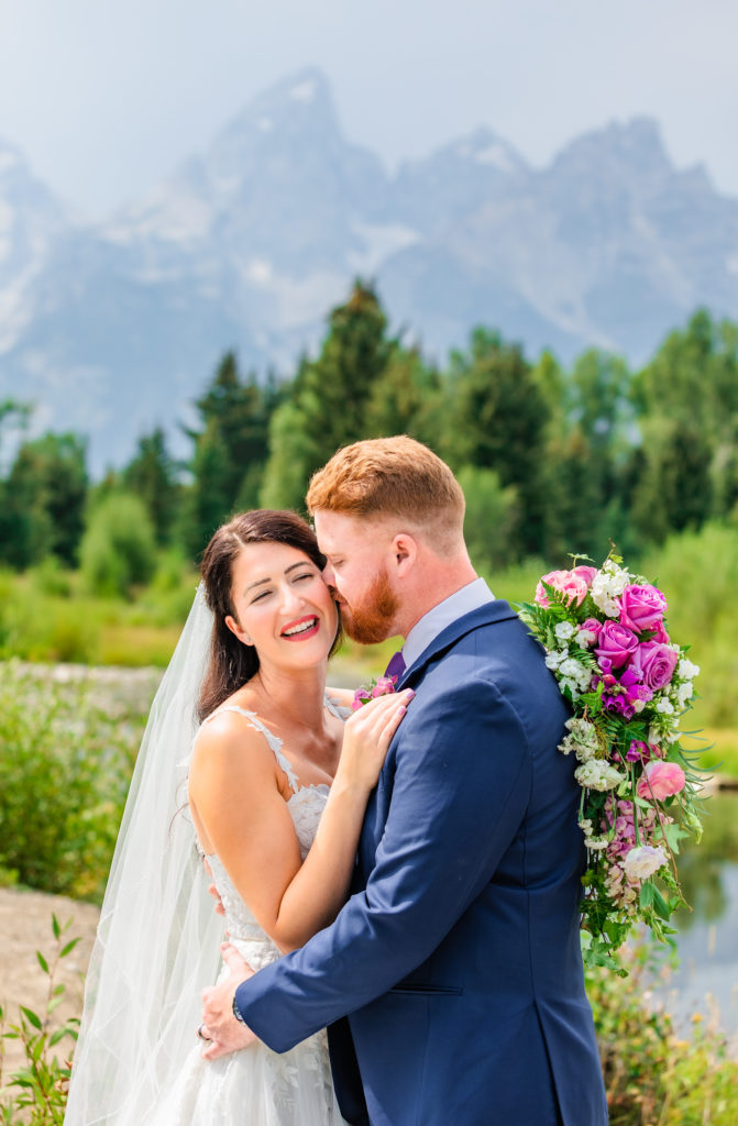 Jackson Hole wedding photographer captures couple laughing during bridal portraits