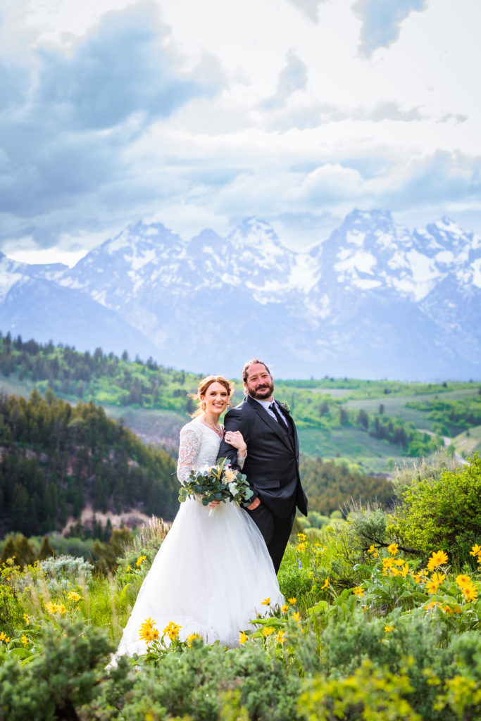 Jackson Hole wedding photographer captures couple hugging during bridal portraits