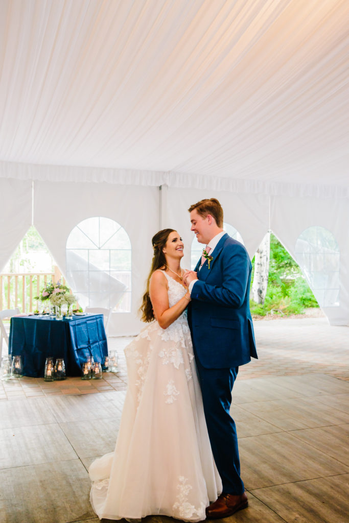 Jackson Hole wedding photographer captures bride and groom dancing together at wedding reception