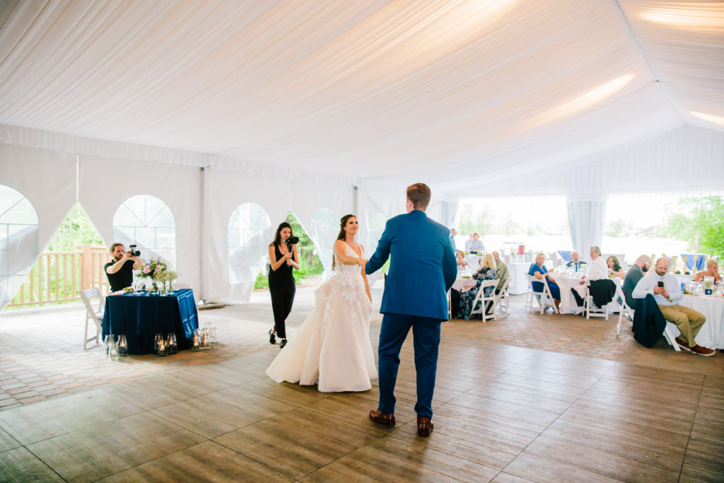 Jackson Hole wedding photographer captures bride and groom dancing during first dance at classy jackson hole wedding venues