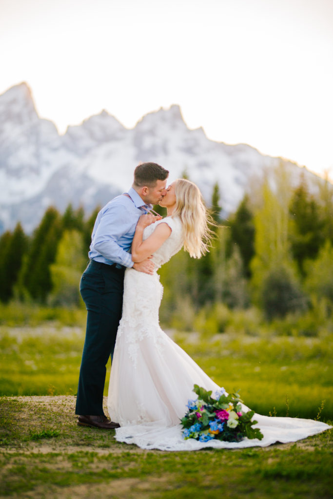 Jackson Hole wedding photographer captures couple kissing after Grand Teton National Park wedding ceremony