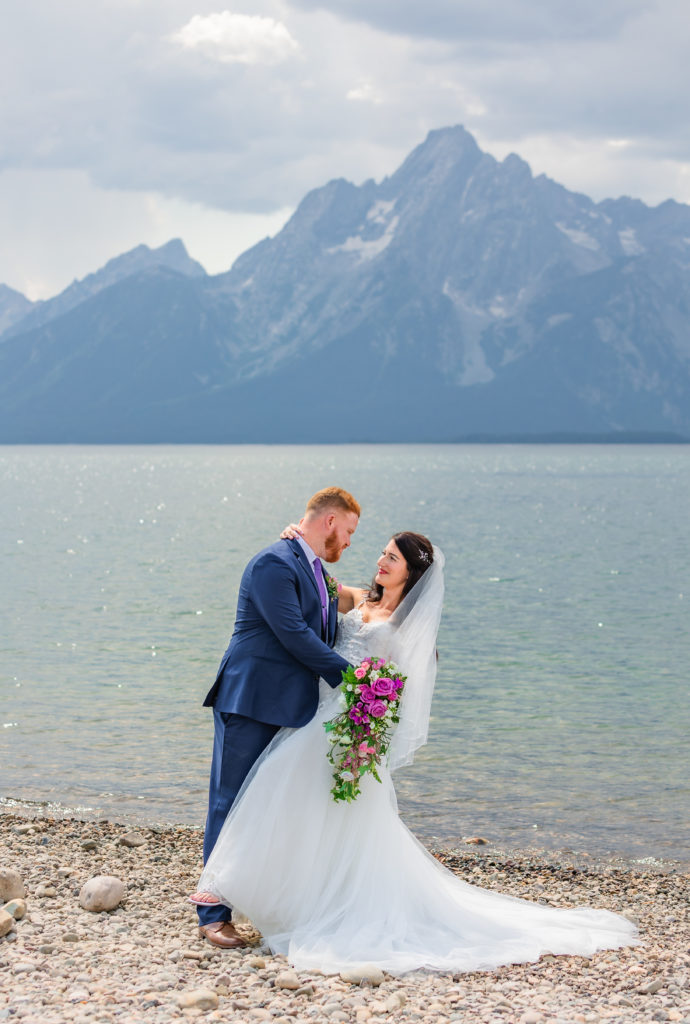 Jackson hole elopement photographer captures groom dipping bride