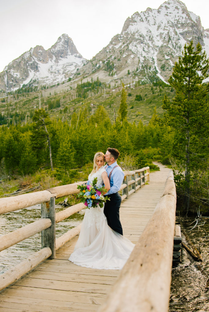 Jackson Hole wedding photographer captures couple wearing wedding attire in grand teton national park