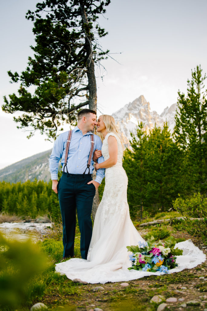 Jackson Hole wedding photographer captures bride and groom hugging in Grand Teton National Park before elopement