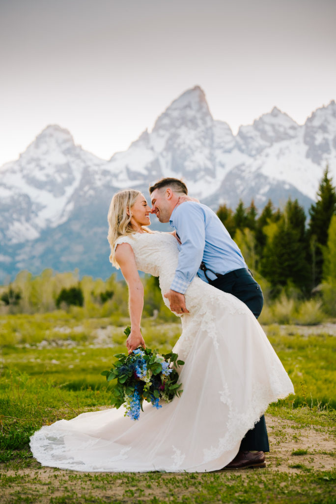 Jackson Hole wedding photographer captures bride and groom kissing in Grand Teton National Park wedding