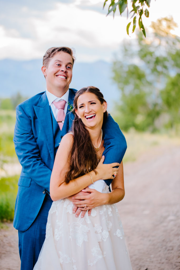 Jackson Hole wedding photographer captures bride and groom laughing together