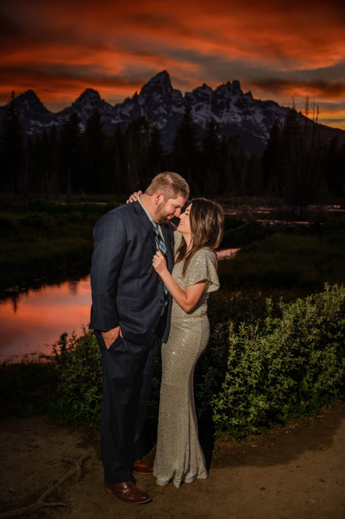 Jackson Hole elopement photographer captures couple hugging during sunset portraits