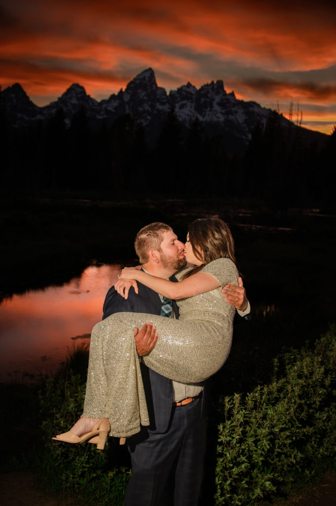 Jackson Hole elopement photographer captures couple kissing and celebrating recent marriage