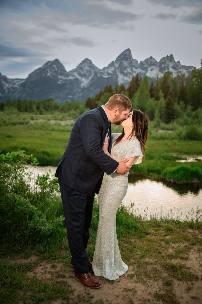 Jackson Hole elopement photographer captures man and woman kissing after Jackson Hole wedding fun