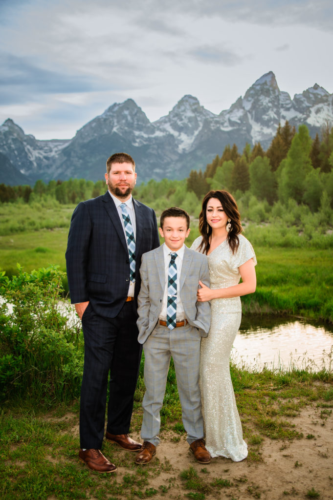 Jackson Hole elopement photographer captures couple standing with son after Jackson Hole wedding