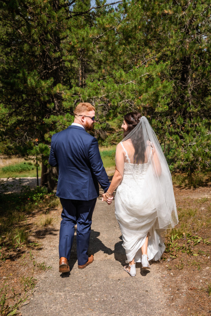 Jackson Hole elopement photographer captures couple walking through grand teton park