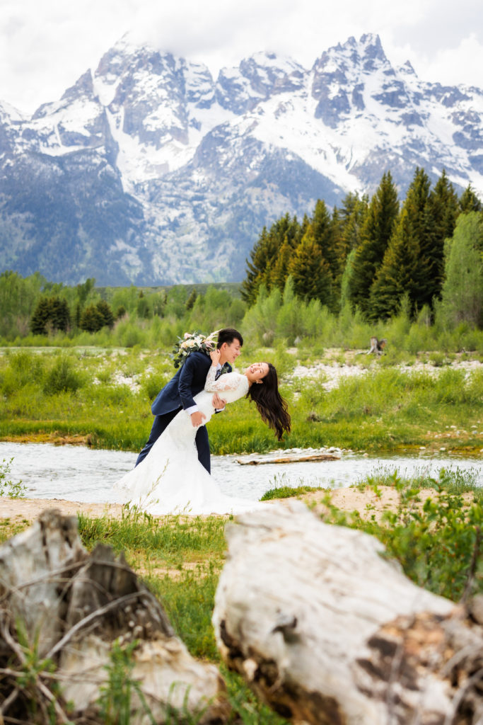 Jackson Hole wedding photographer captures couple kissing during bridal portraits