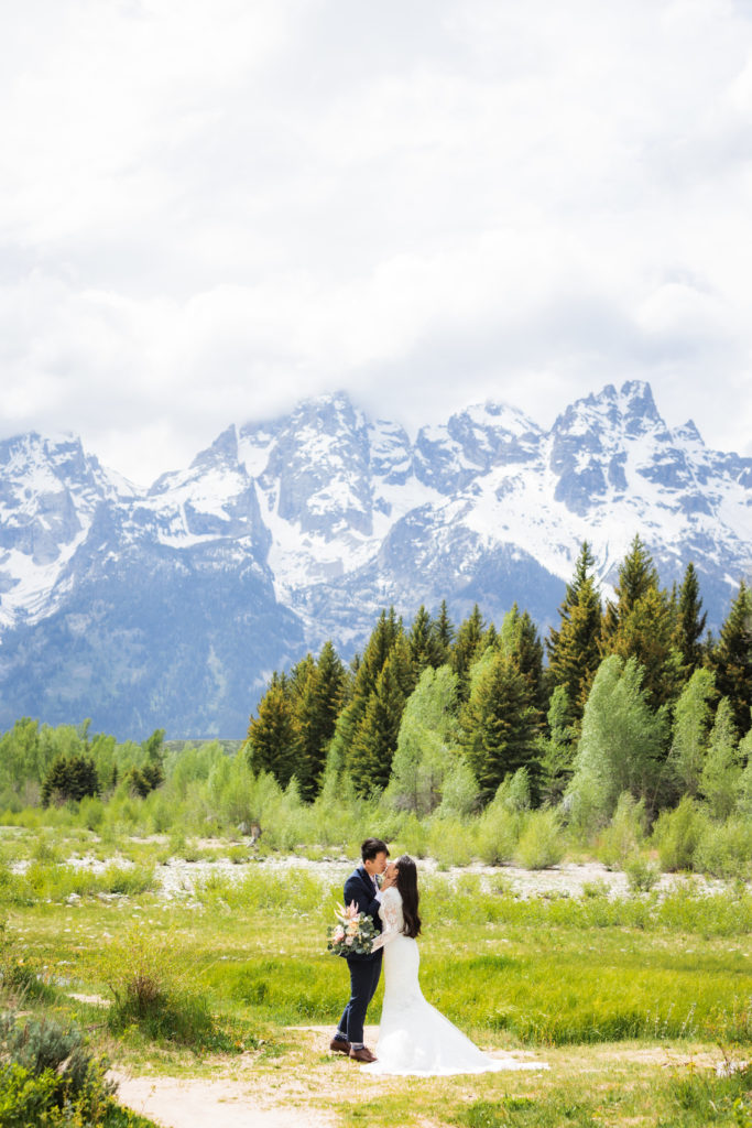 Jackson Hole wedding photographer captures couple after wedding in Schwabacher Landing