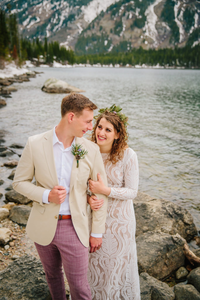 Jackson Hole wedding photographer captures couple laughing together after grand teton wedding