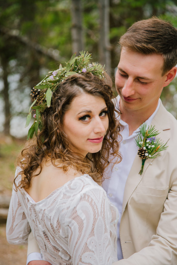 Jackson Hole wedding photographer captures bride looking over shoulder in wedding attire