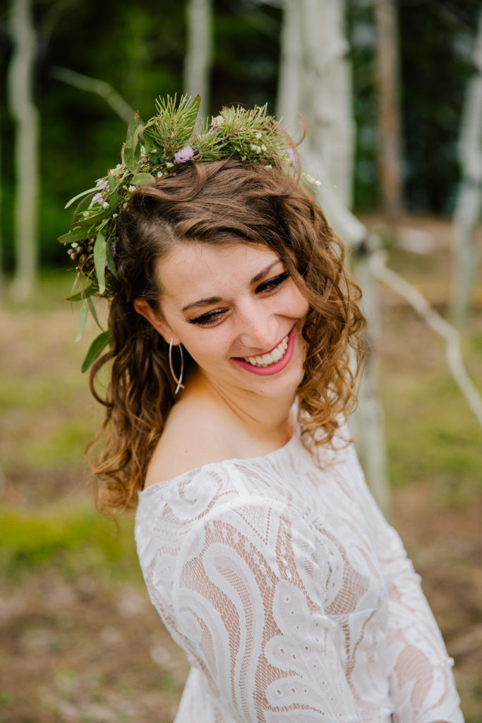 Jackson Hole wedding photographer captures bride wearing greenery crown with wedding dress