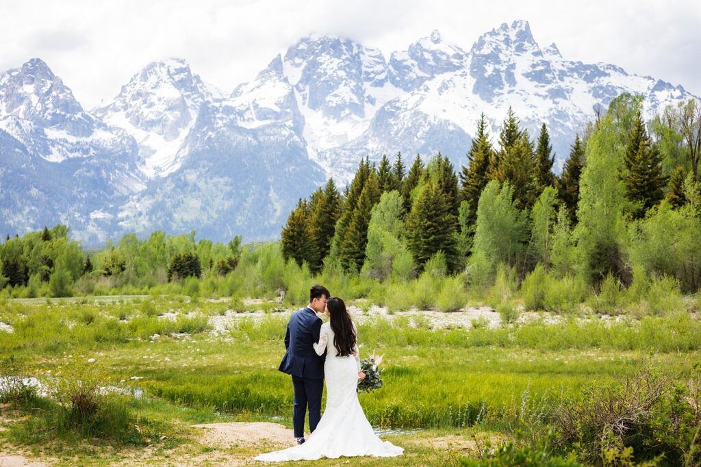 Jackson Hole wedding photographers capture bride and groom standing together in top wedding venues in Jackson Hole - Grand Teton National Park
