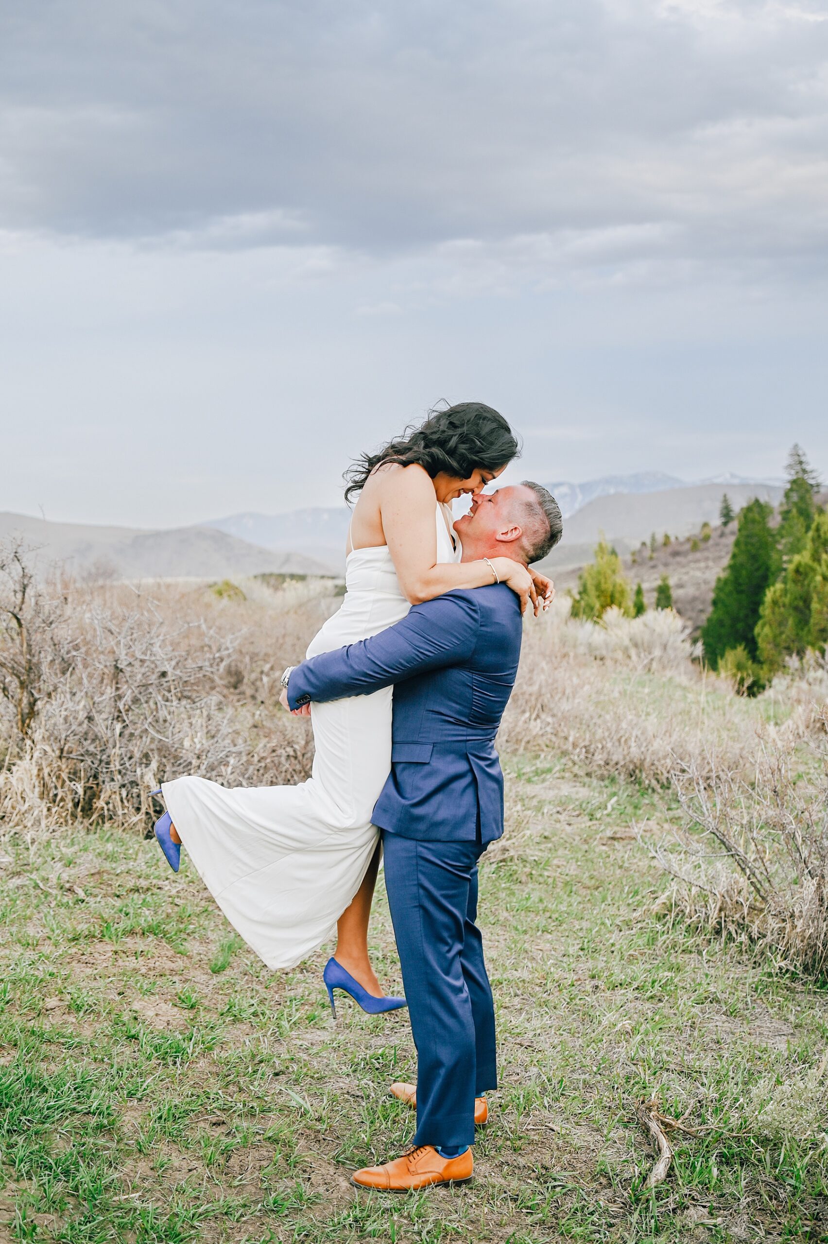 Jackson Hole wedding photographers capture bride and groom kissing after elopement