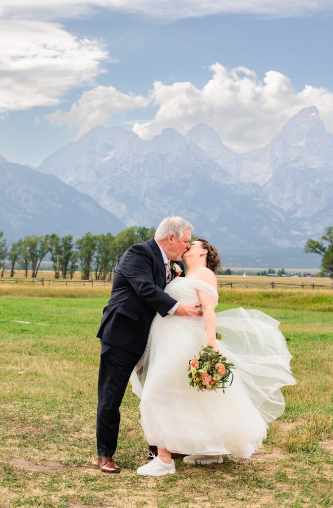 Jackson Hole photographers capture couple kissing after Jackson Hole elopement.