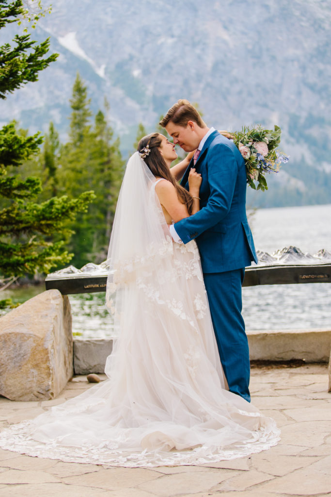 Jackson Hole wedding photographer captures couple kissing as husband and wife