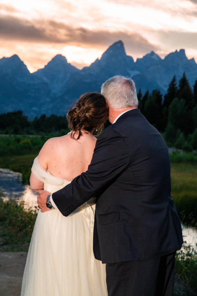 Jackson hole photographer captures couple together watching sunset in Grand Teton mountains