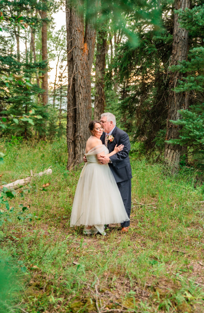 Jackson Hole elopement photographer captures couple together in forest 
