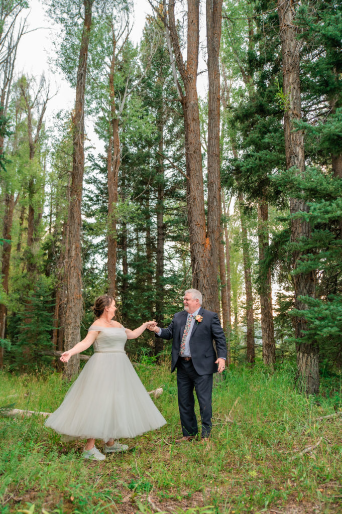 Jackson Hole elopement photographer captures couple dancing in forest