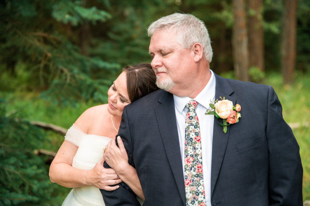Jackson Hole elopement photographer captures bride leaning on groom's shoulder 
