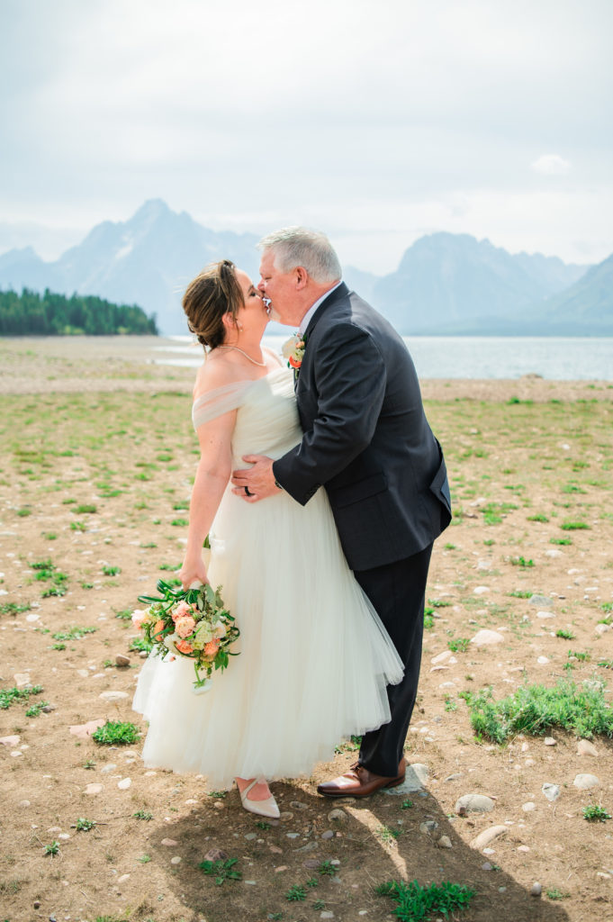 Jackson Hole elopement photographer captures bride and groom kissing after Windy Colter Bay Elopement