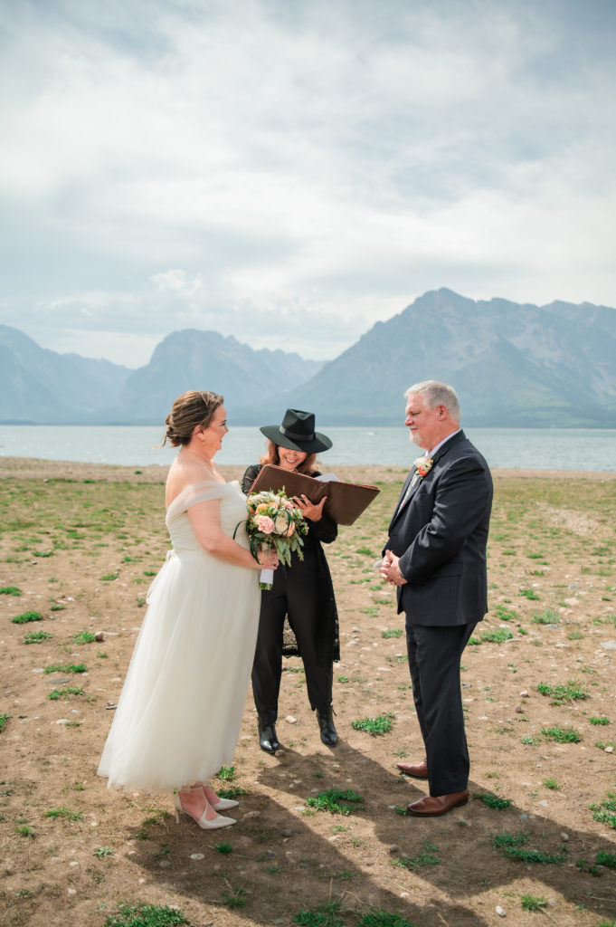 Jackson Hole wedding photographer captures bride and groom during ceremony at Windy Colter Bay Elopement
