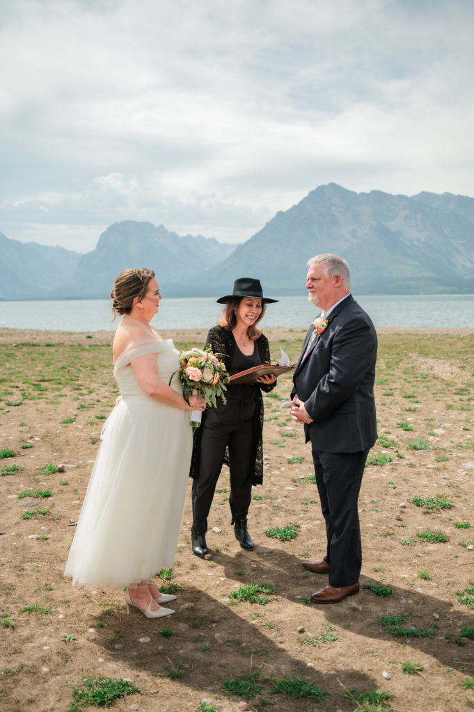 Jackson Hole photographers capture couple during wedding ceremony at weekday wedding