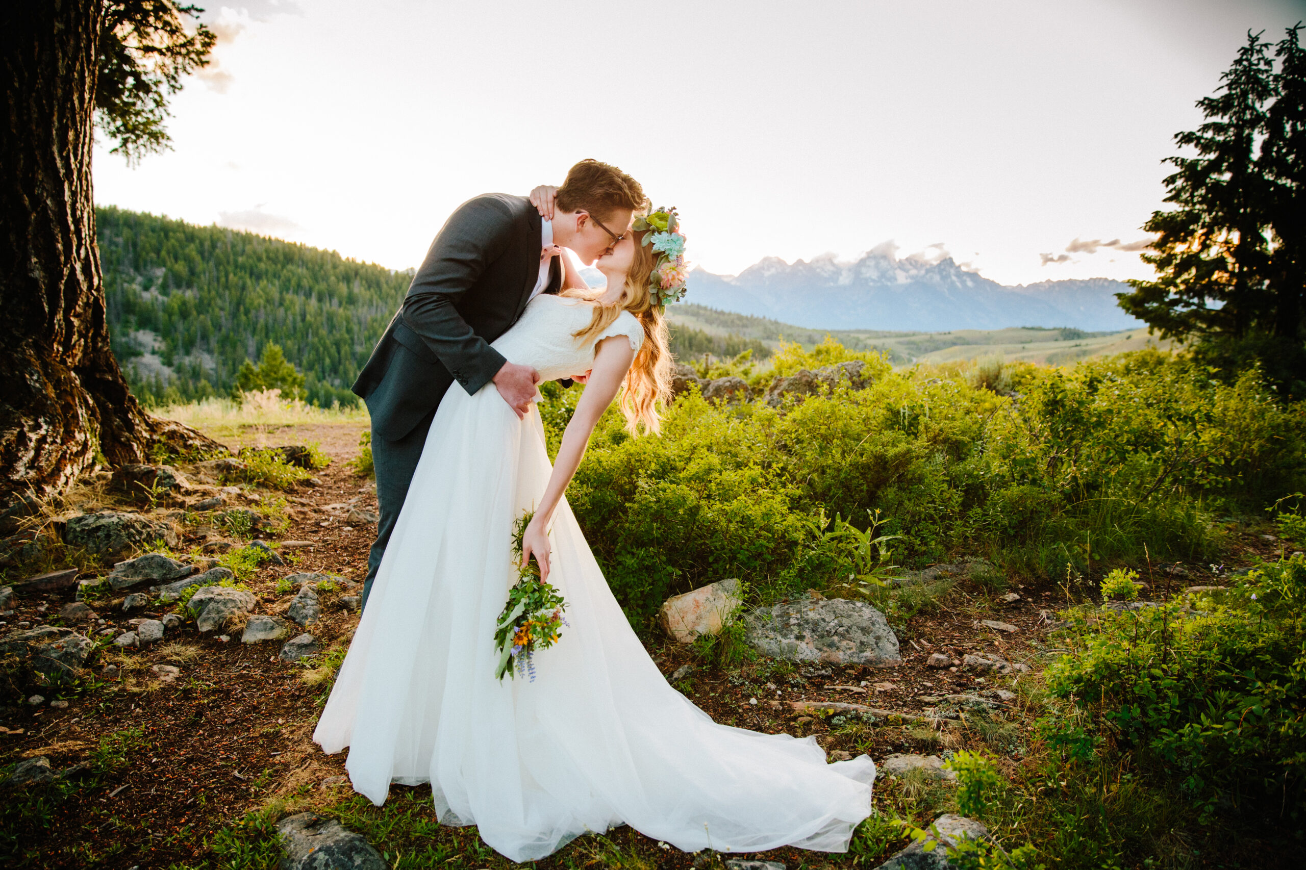 Jackson Hole wedding photographer captures couple kissing after elopement at Wedding Tree