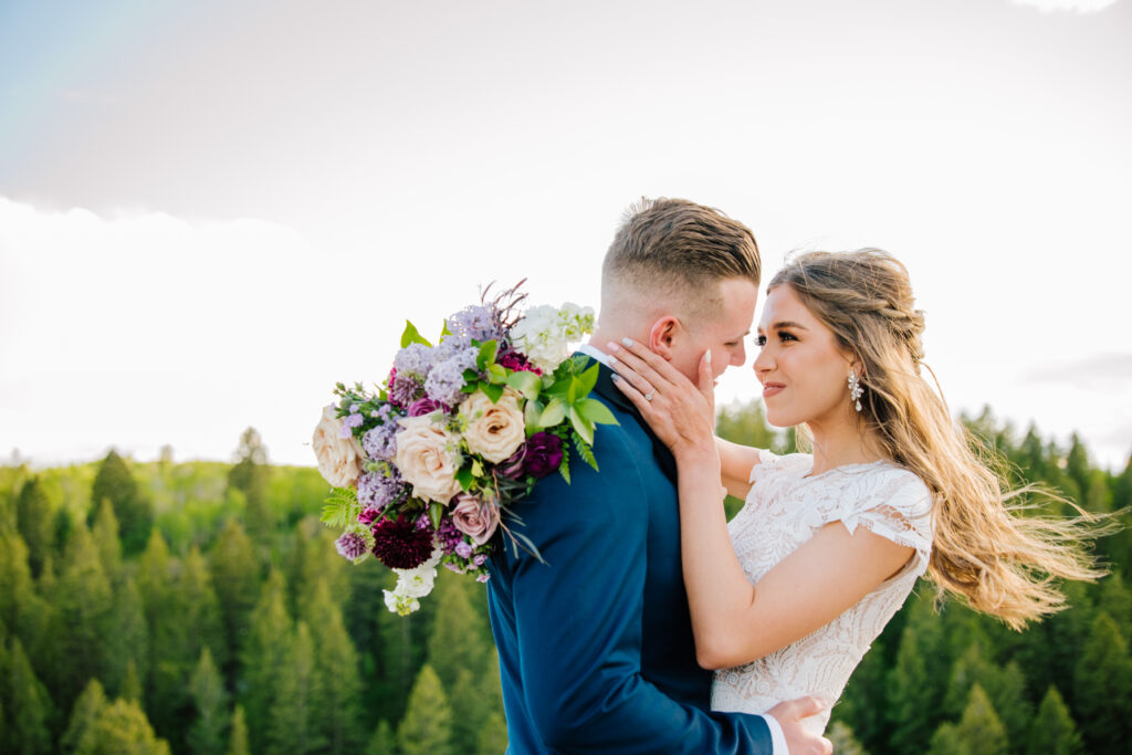 Jackson Hole photographer captures close up of bride and groom embracing during bridal portraits after Jackson Hole elopement