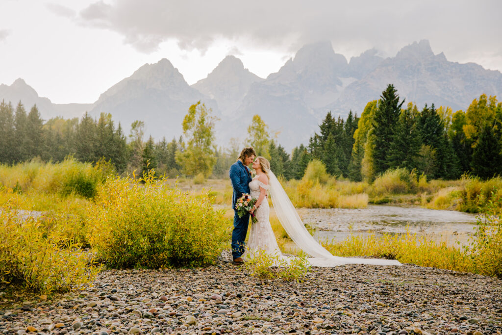 Jackson Hole elopement photographer captures bride and groom embracing in Grand Teton wedding