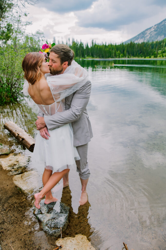 Jackson Hole photographers capture couple kissing near water