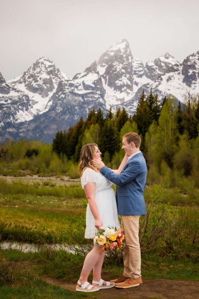 bride and groom wipe tears off each other's face during their Jackson Hole Elopement in Jackson Hole.